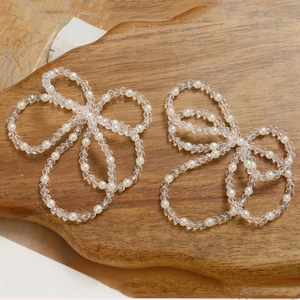 Handcrafted white pearl and transparent bead bow accessories for hair and jewelry DIY