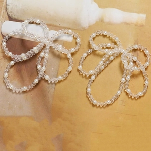 Detail of white faux pearls and clear faceted crystal beads for handmade DIY jewelry