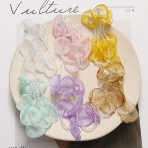 Detail of long fringe floral pendants with organza petals and clear acrylic beads