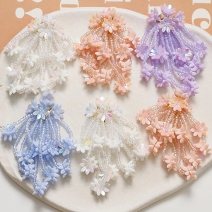 Handmade beaded flower tassel earrings in pastel pink, purple and blue colors