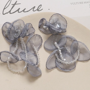 Detail of grey organza flower petals and crystal bead tassels for handmade jewelry