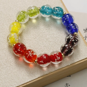 Bracciale di perle di vetro luminose 12mm con foglia d'argento e distanziatori