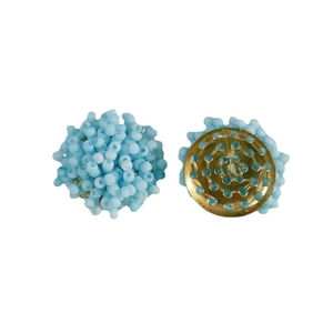 Handmade light blue macaron seed bead flower earrings with gold base on white background