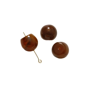 DIY jewelry kit with amber brown translucent beads and a gold pin on a white background