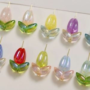 Macro detail of acrylic tulip flower charms with iridescent finish for DIY jewelry
