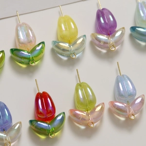 Macro shot of colorful AB tulip acrylic beads with gold hooks for DIY jewelry making