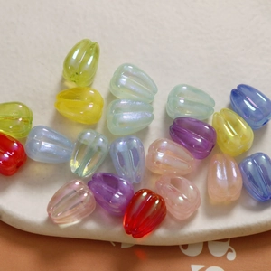 Macro shot of colorful tulip acrylic beads with iridescent coating for DIY jewelry