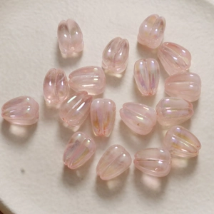 Macro shot of light pink AB coated tulip acrylic beads for DIY jewelry making