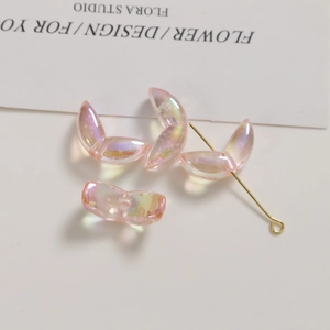 Detailed macro of tulip petal acrylic beads with pink AB iridescent finish for jewelry