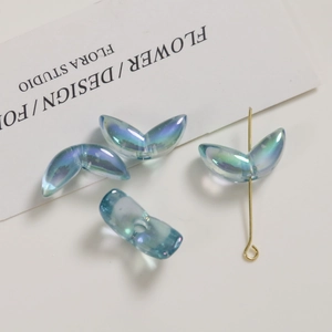 Detail of blue iridescent acrylic flower petal beads for DIY jewelry making