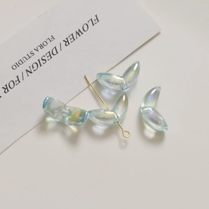 Detailed view of light blue iridescent tulip petals and acrylic beads for DIY jewelry