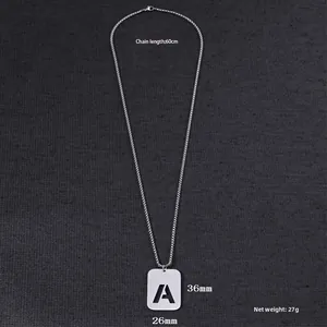 Detailed macro view of silver hollow letter A rectangular pendant on steel chain