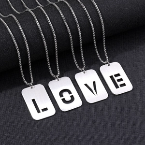 Detailed macro view of four stainless steel LOVE letter pendants on sturdy box chains