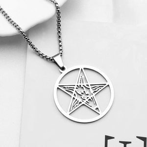 Detail of silver pentagram star pendant with box chain in gothic punk metal style