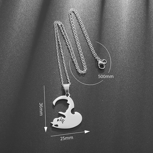 Detail view of interlocking cat pendant with dimensions 36mm by 25mm on 500mm chain