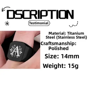 Detailed macro view of black square signet ring with letter A engraving and polished finish