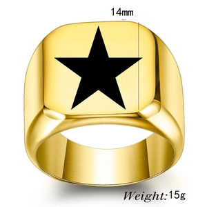 Macro detail of 14mm gold men's signet ring with black star motif weighing 15g
