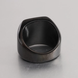 Macro shot of 14mm punk square ring featuring brushed inner metal and gunmetal wood texture