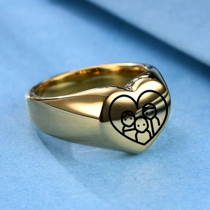 Detailed macro view of heart-shaped gold signet ring with family laser engraving