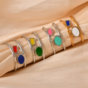 Colorful geometric enamel open rings in gold and silver finish on champagne silk background