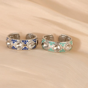 Vintage style adjustable stainless steel rings with colorful enamel on silk background