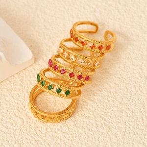 Set of 5 gold open rings with colorful square zircons and textured braided bands