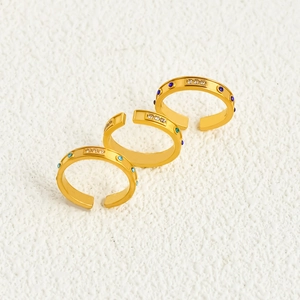 Three gold plated open rings with colorful zircon inlays and rectangular diamond accents