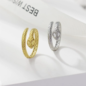 Close-up of gold and silver snake rings featuring detailed scale textures and adjustable bands