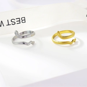 Close-up of gold and silver snake texture adjustable open rings with clear metal details
