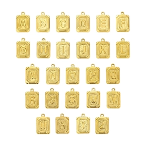26 gold square initial pendant set with vintage embossed letters and sunburst texture