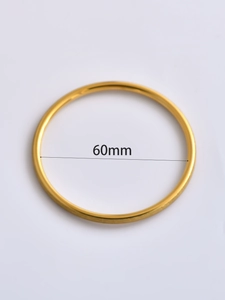 Top view of a gold 6mm minimalist bangle showing a 60mm inner diameter dimension