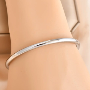 Minimalist high-polished silver open bangle with a sleek mirror finish and round profile