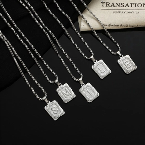 Silver square pendant necklace set featuring 'SMILE' engraved alphabet letters