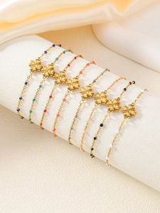 Dettagli di otto bracciali bohémien in acciaio al titanio oro con ciondoli quadrifoglio