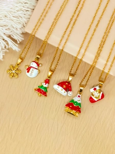 Detailed close-up of six gold Christmas necklaces with colorful enamel charms
