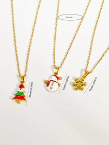 Detailed view of Christmas necklace set showing sizes for tree, snowman and snowflake charms