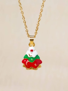 Detail of Christmas tree pendant necklace with red star and festive enamel colors