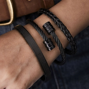 Close-up of black stainless steel men's bracelet set with Lord's Prayer engraving
