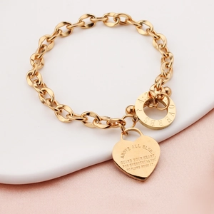 Gold chain bracelet with heart pendant featuring engraved Proverbs 4:23 scripture verse