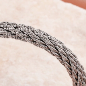 Bracciale regolabile in cavo d'acciaio inossidabile intrecciato con perline rotonde