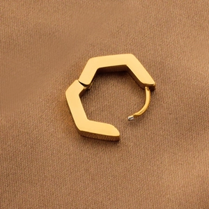 Polished gold hexagonal stainless steel huggie earring with a minimalist geometric design