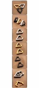 Macro shot of geometric stainless steel hoop earrings in black, gold, and silver finishes
