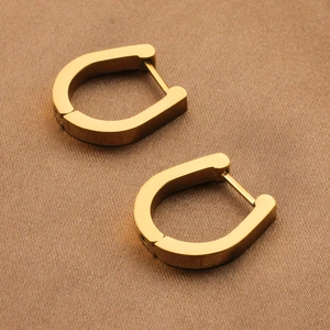 Minimalist golden stainless steel U-shaped hoop earrings with geometric horseshoe design