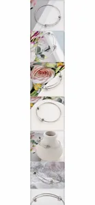 Detail of adjustable stainless steel spring coil bracelet with silver metallic finish