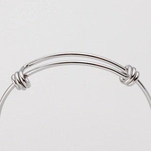 Polished silver adjustable stainless steel coil bracelet with flexible sliding clasp