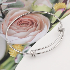 Polished silver adjustable stainless steel spring coil bangle with sliding knots