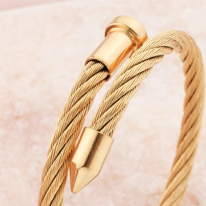 Gold twisted cable stainless steel open bangle with minimalist punk nail style finish