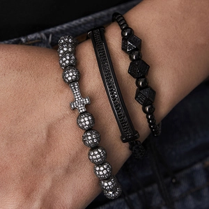 Close-up of hip hop men's triple bracelet set with cross and micro-pave crystals