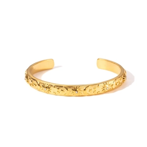 Brazalete vintage de acero inoxidable con baño de oro 18k grabado con sol luna y estrellas