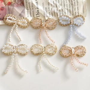 Elegant crystal bow tassel earrings with faux pearls and beads in various colors